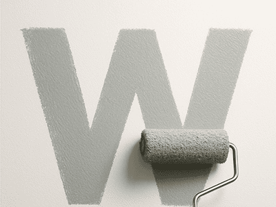 A paint roller demonstrating the W technique by painting a large W on a wall.