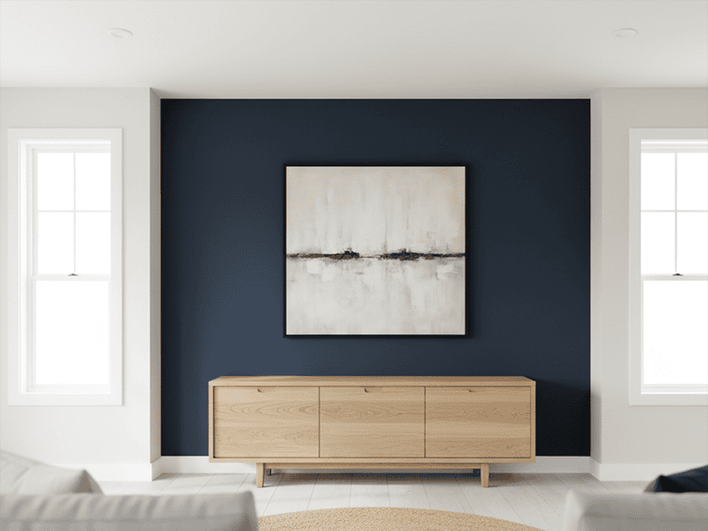 A freshly painted dark blue feature wall in a modern living room.